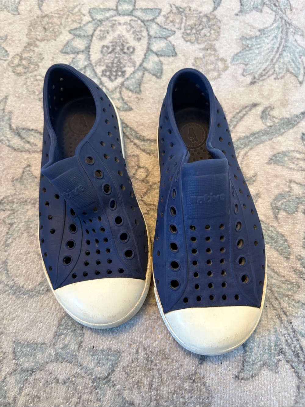 Navy blue boys Native shoes.